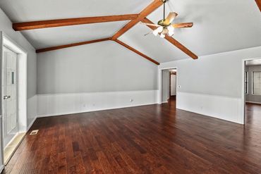 Real estate photographer in western Oklahoma took this photo of a den with hardwood floors