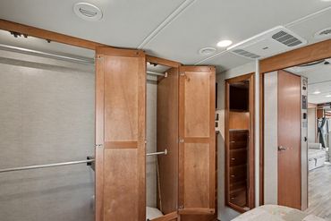 Photo of the hallway and storage cabinets inside an RV for sale