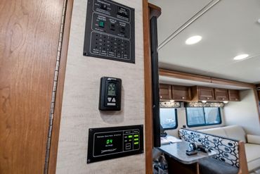 Photo of the control panel and bedroom entrance inside an RV for sale