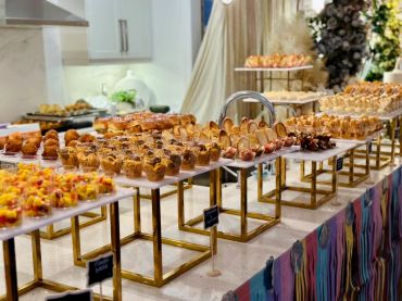 A lavish dessert buffet with various pastries and sweets.