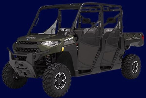 A rugged green Polaris XP off-road utility vehicle with four seats.
