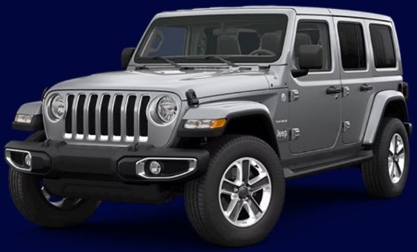 Silver Jeep Wrangler parked against a dark blue background.