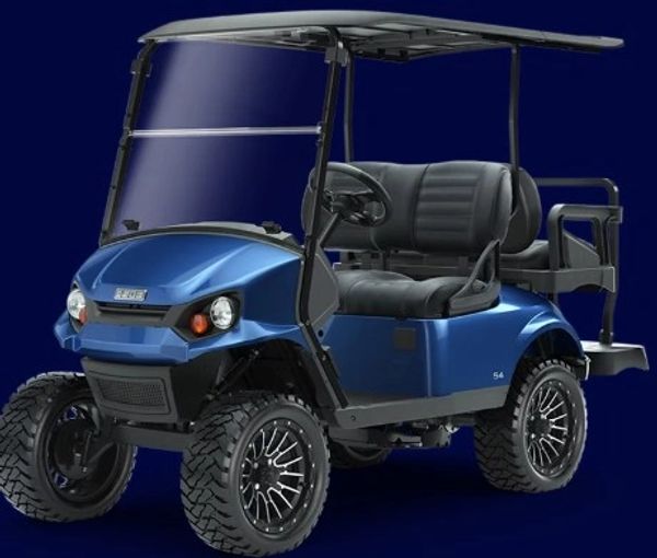 Blue off-road golf cart with large tires and a roof.