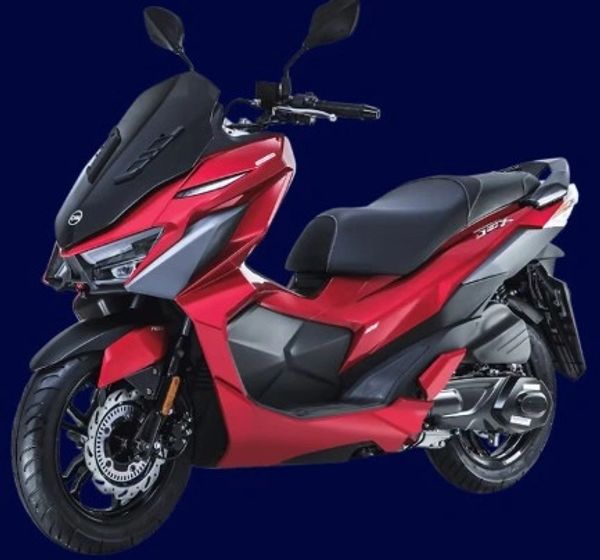A sleek red and black modern scooter against a dark background.