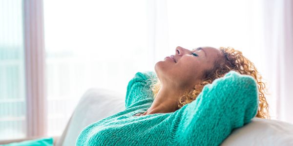 young woman feeling relaxed on the sofa