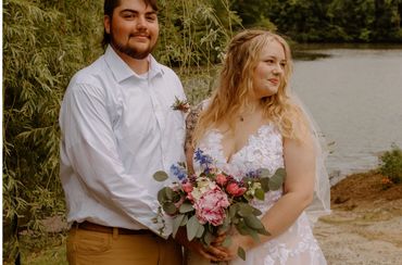 Bride’s bouquet w/ peonies, roses, larkspur, & eucalyptus; Groom’s pocket boutonniere 