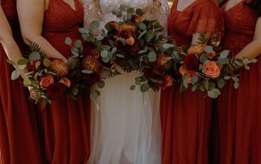 Fall bouquets with dark red roses, Orange Calla Lilies, Bronze Cremones, ferns and eucalyptus
