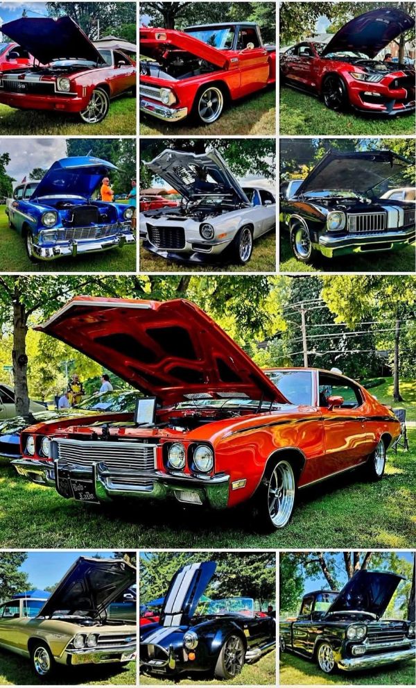 Classic cars at an outdoor show with open hoods.