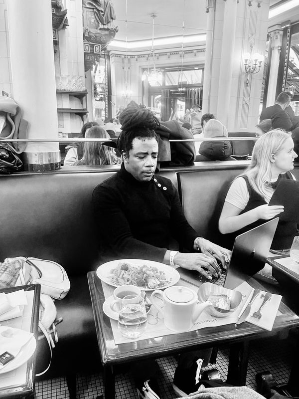 writing in the same place, Les Deux Magots in Paris where James Baldwin and Richard Wright would con