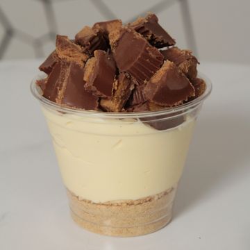 Cheesecake cup with crumble and Reese's cup topping