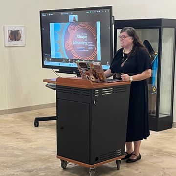 Nancy Strickland Chavis speaks from behind a podium.