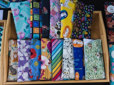 A photo of multiple glasses cases in a variety of colours and fabrics.