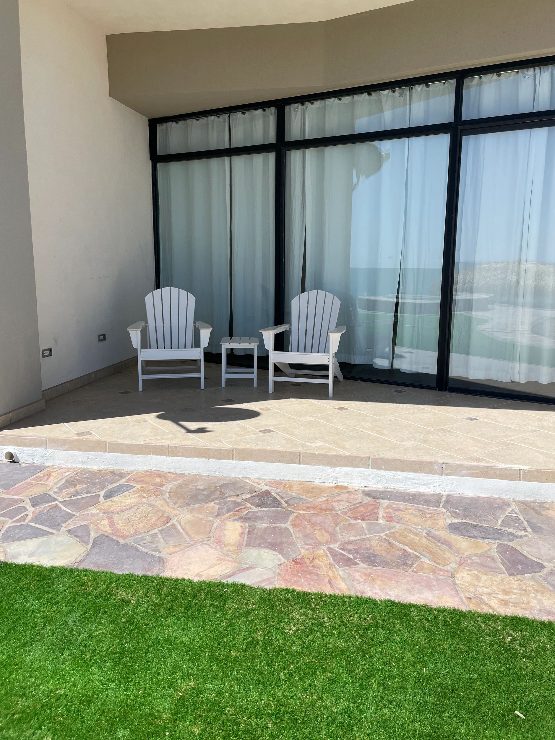 Patio of ground level ocean front and pool side condo rental at Palacio Del Mar.