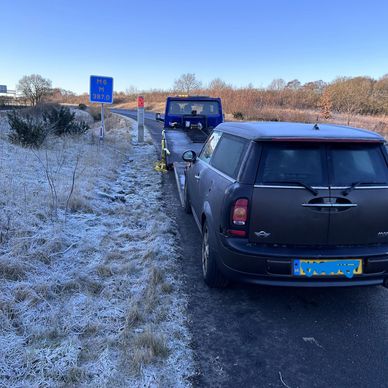 Recovery truck about to recover a car from the motorway in Lancaster.