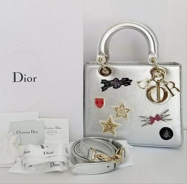 White Dior bag with lucky badges
