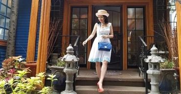 Woman in white dress and sun hat