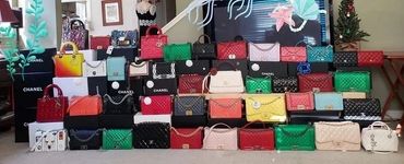 Collection of colorful Dior handbags
