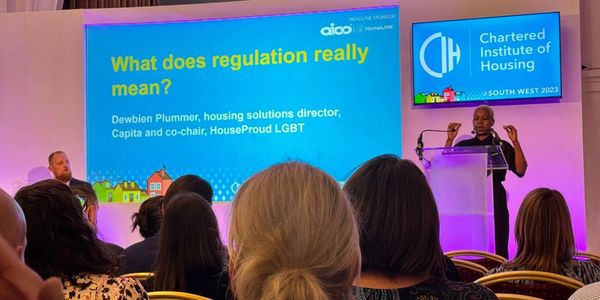 Image of Dewbien speaking at a CIH conference