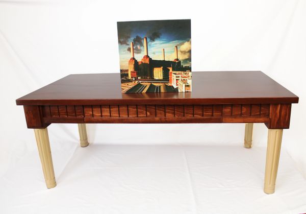 coffee table inspired by pink floyd animals album cover with battersea power station.