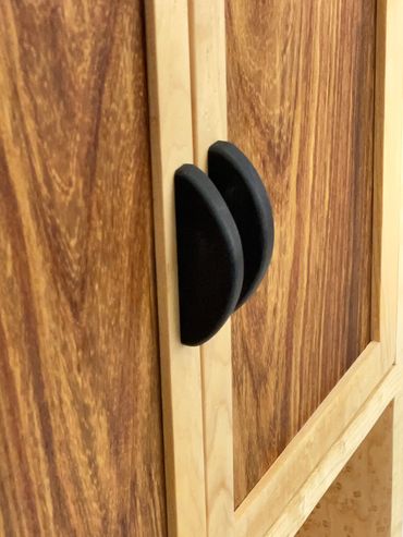 close up of the handmade ebony door pulls