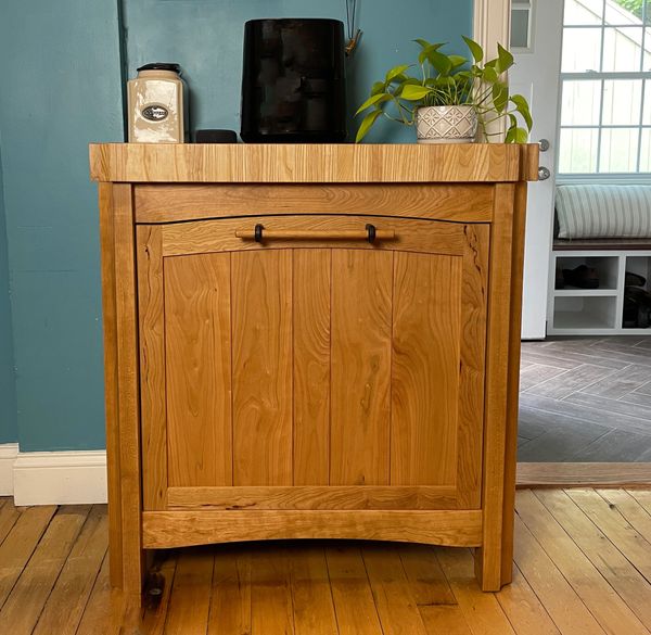 Freeshanding kitchen island with hidden trash and recycle bin. Cherry with Ash butcherblock top