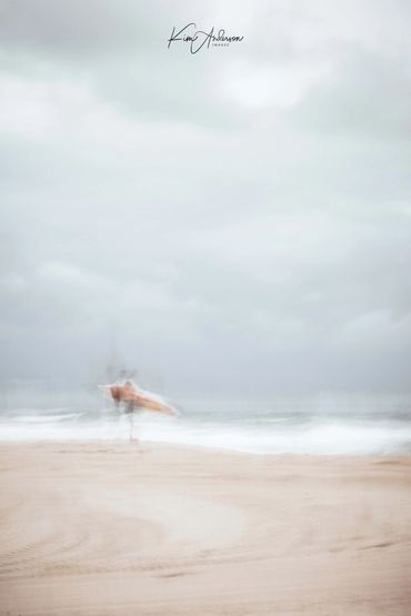 Lone Surfer on the Beach at Dicky Sunshine Coast - done with Intentional Camera Movement