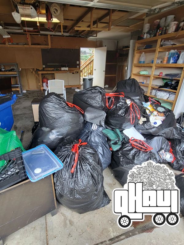 Visualize a garage with heaps of trash bags and unwanted household items stacked high and wide!
