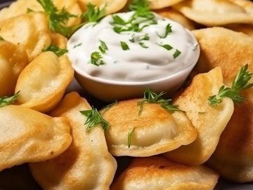 Our Cheddar Potato Pierogi served with Sour Cream.. a favorite in Parma!!