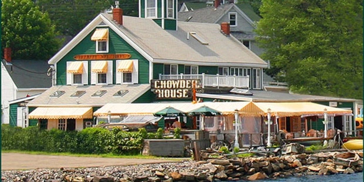 Chowder House by the waterfront with yellow awnings.