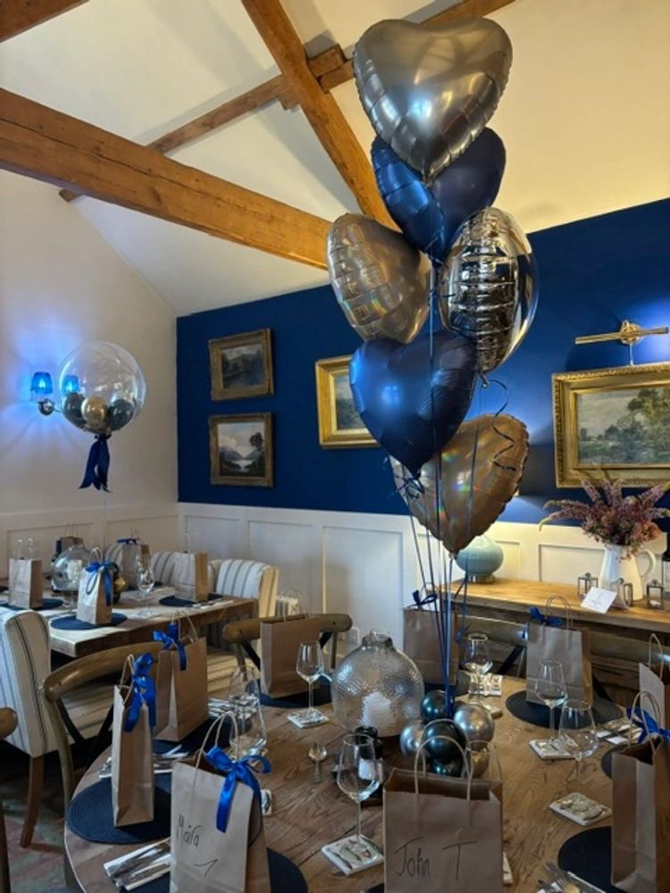 The Wheatsheaf Inn dining room with blue and silver balloons on the table
