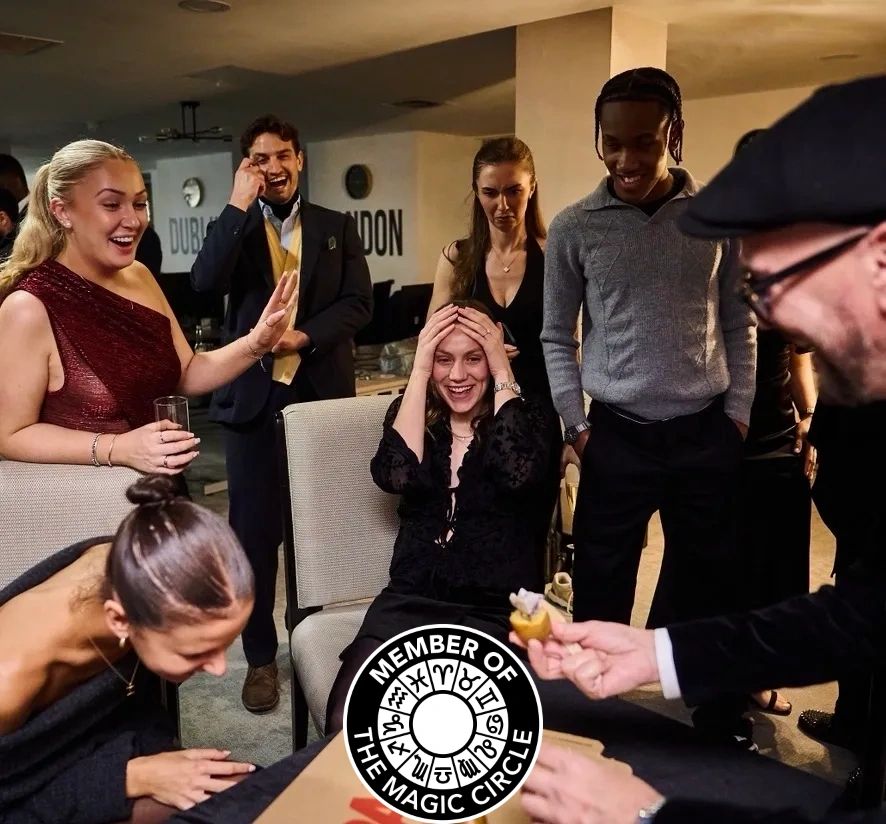 A close-up magic experience around the table performed by Ady Lloyd
