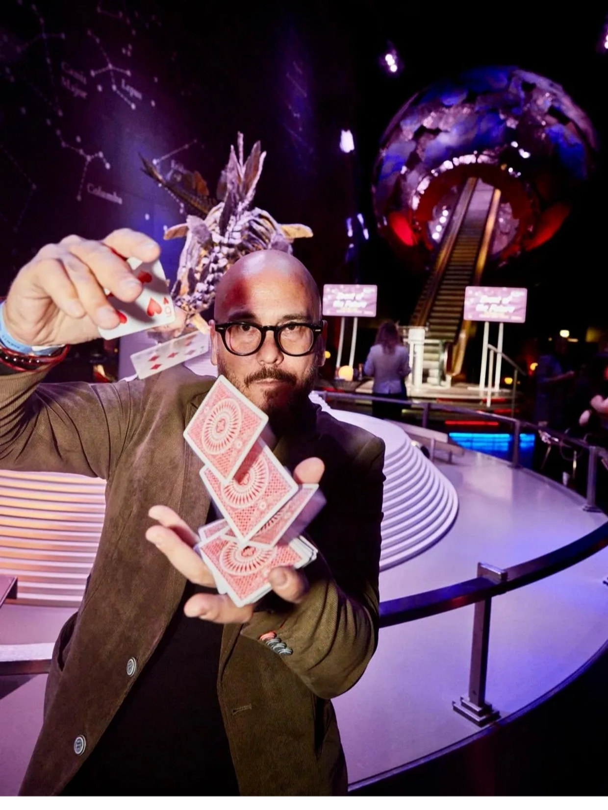 Ady Lloyd performing card magic at the Natural History Museum in London