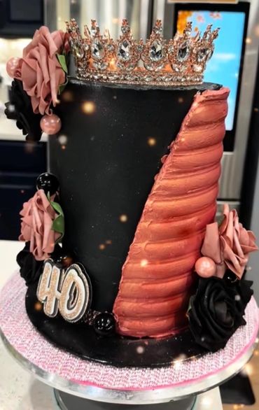 Elegant black and rose gold 40th birthday cake with crown.