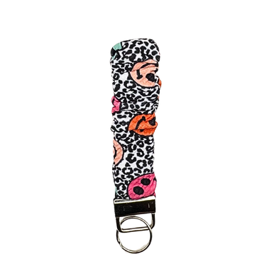 Colorful fabric keychain with animal print and lips design.