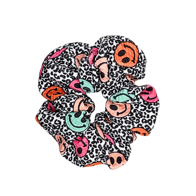 Colorful scrunchie with smiley faces and leopard print pattern.