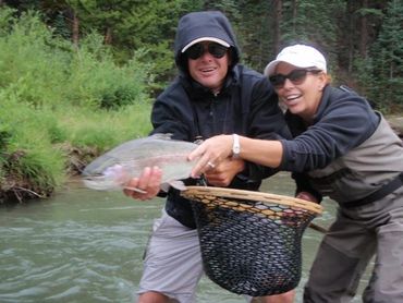 Couple holding fish