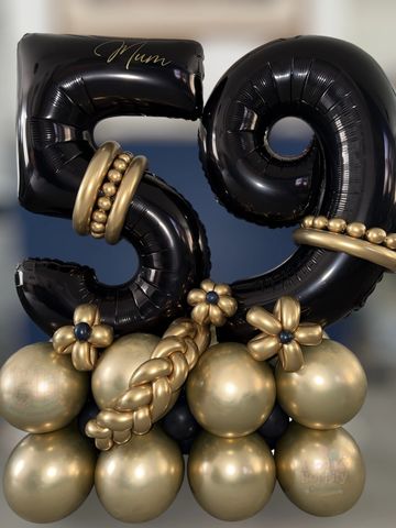 Black and gold balloon arrangement celebrating 59 years.
