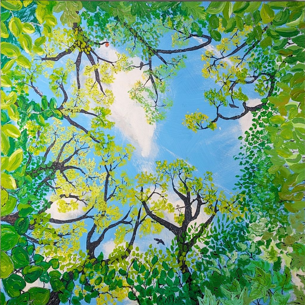 As if lying on one's back, the view skyward through a tree canopy of summer leaves
