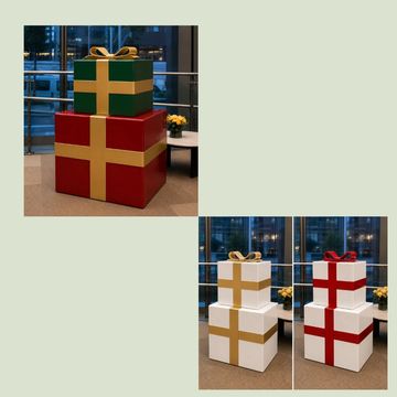 Large decorative gift boxes stacked indoors with different colored ribbons.