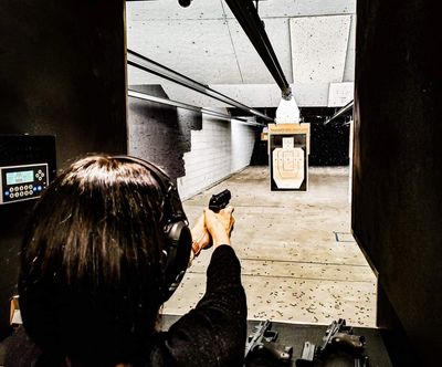 A student practicing marksmanship at the shooting range.