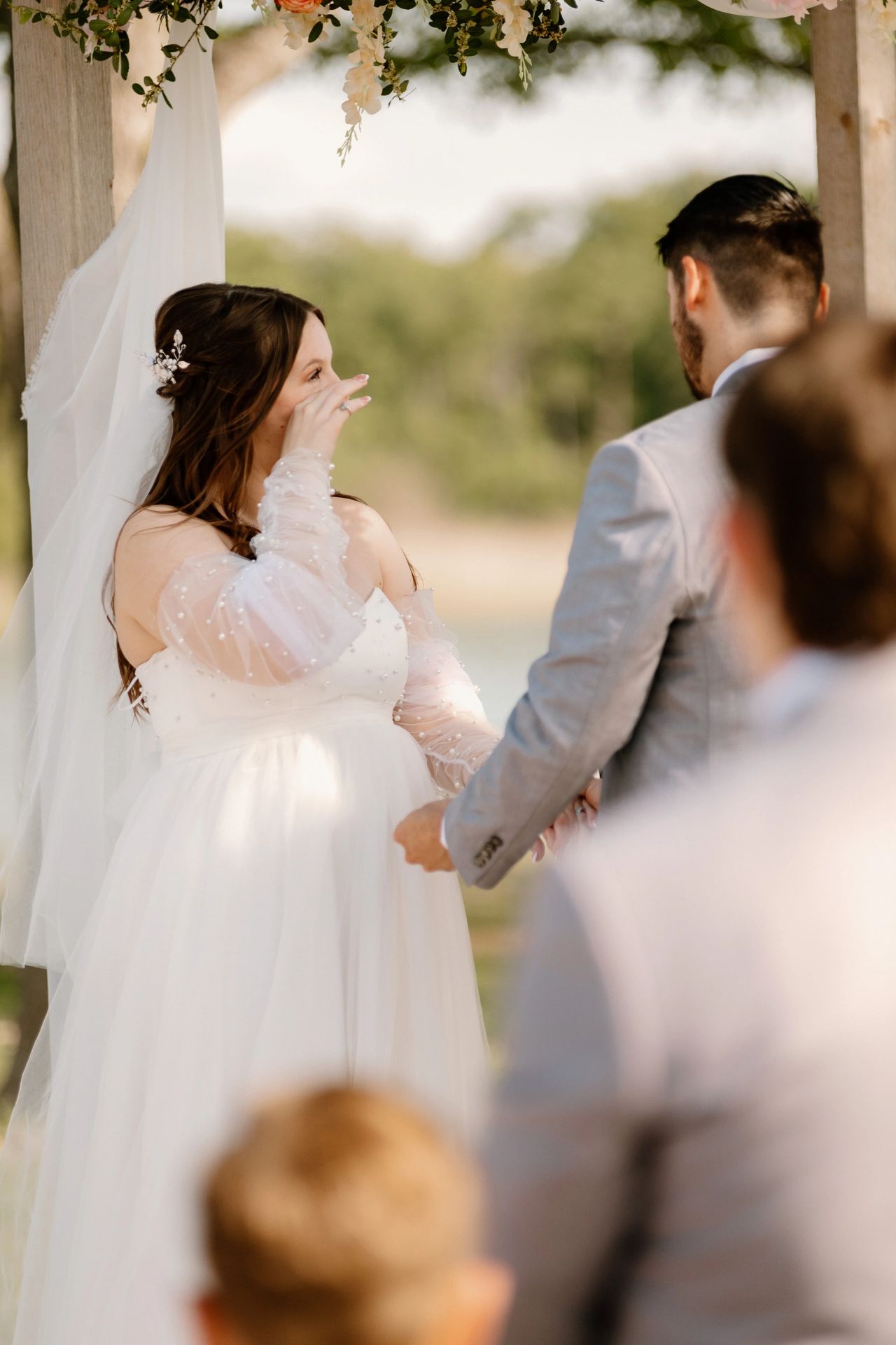 East Texas wedding venue near Dallas with bride crying during personal vows.