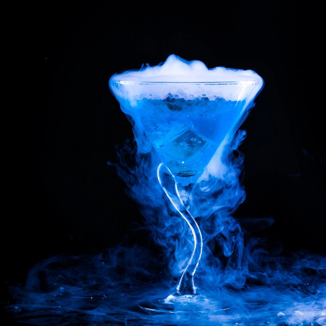 Corsicana wedding venue near Dallas with electric blue smoking cocktail.