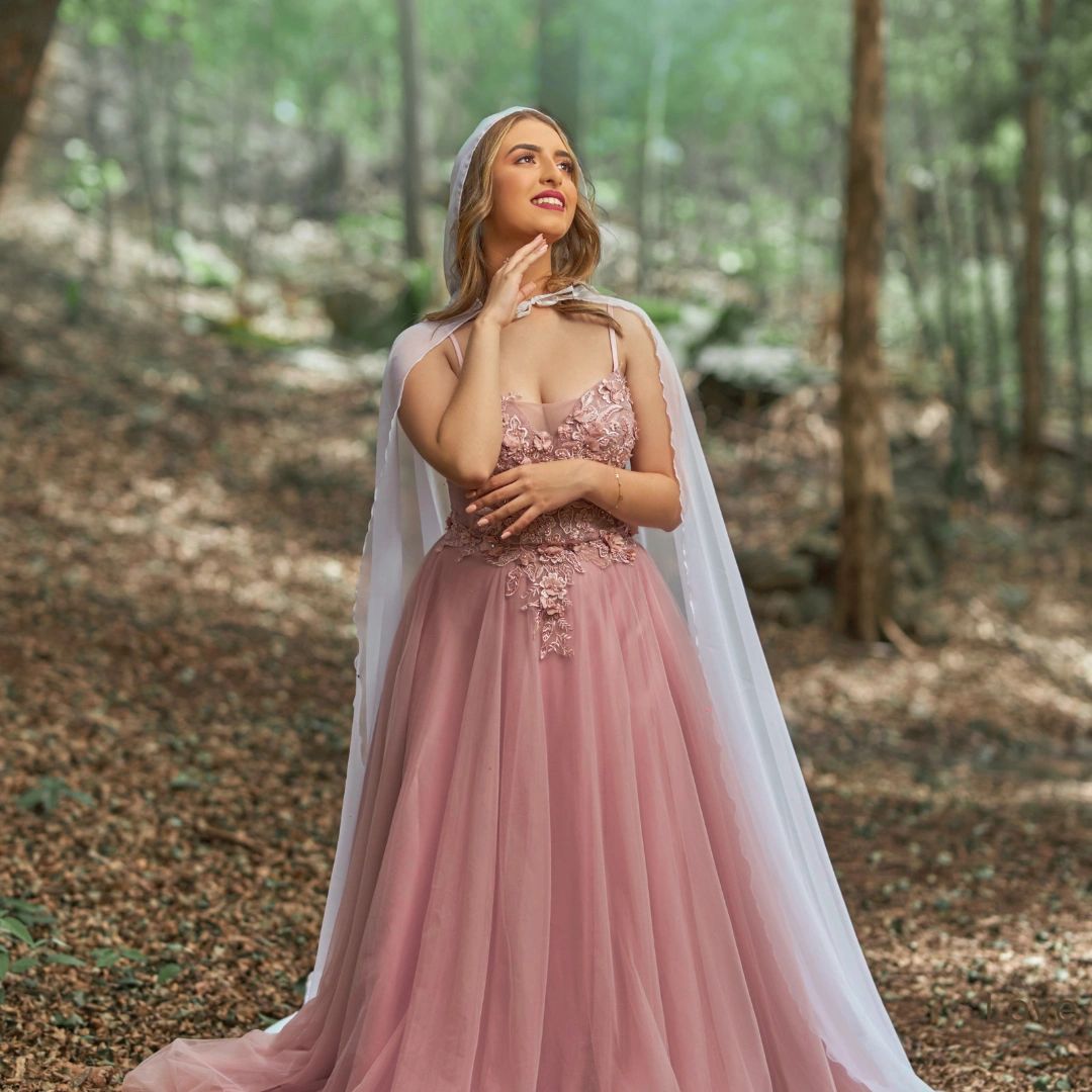 Princess bride in pink wedding dress at Dallas wedding venue near East Texas.
