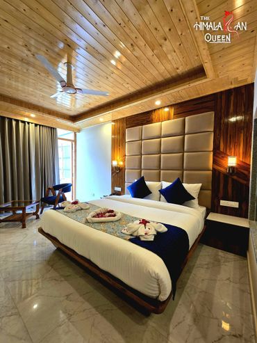Luxurious bedroom with wooden ceiling and stylish decor.