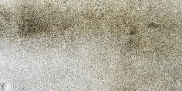 Dirty and stained fabric surface.