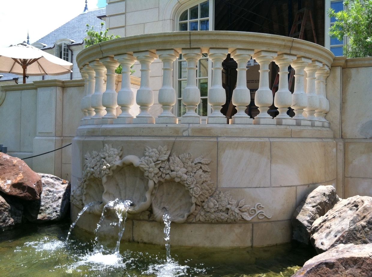 A fountain in front of a house