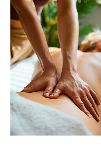 Close-up of hands giving a relaxing back massage.