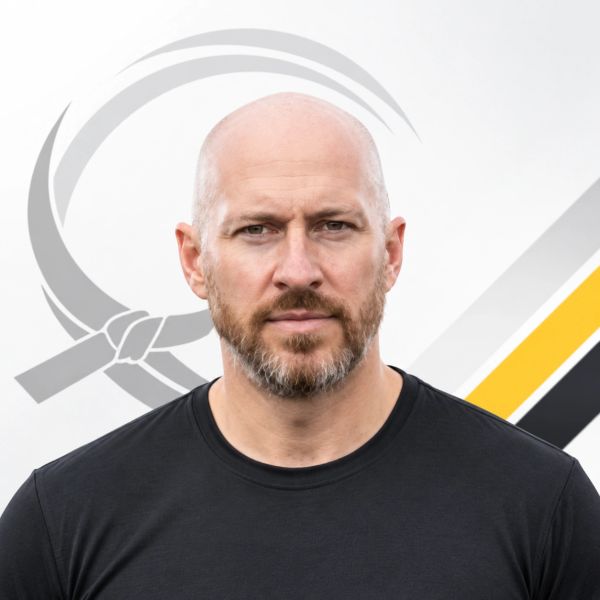 Bald man with beard wearing black shirt