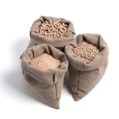 Three cloth bags filled with different types of granular materials.