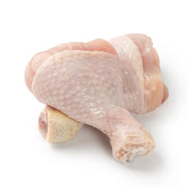 Raw chicken drumsticks on a white background.